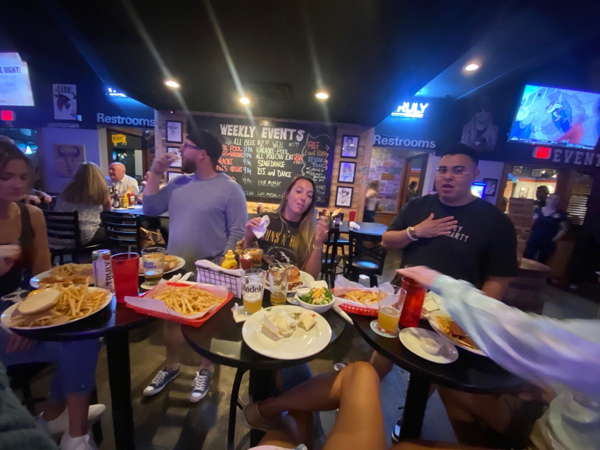Friends enjoying an evening inside Canton Icehouse
