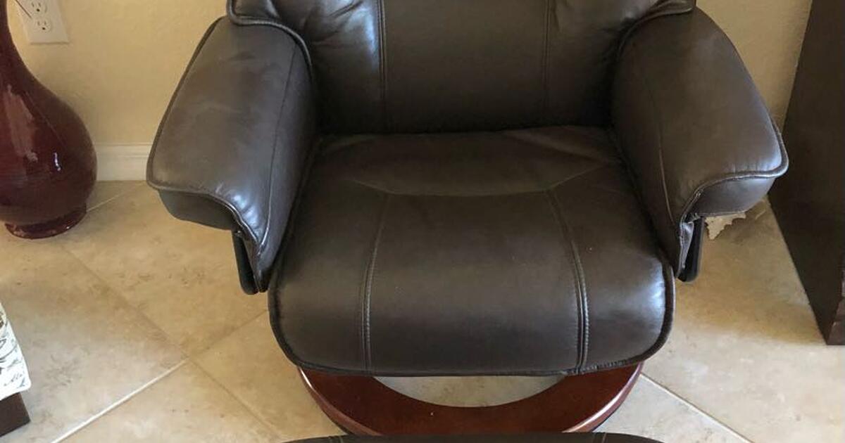 Pair of Benchmaster leather swivel reclining chair and ottoman for 400
