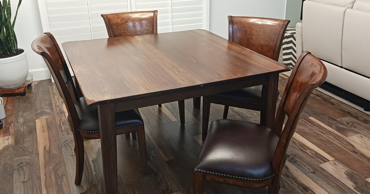 Solid wood, heavy dining table with 4 matching chairs for 140 in