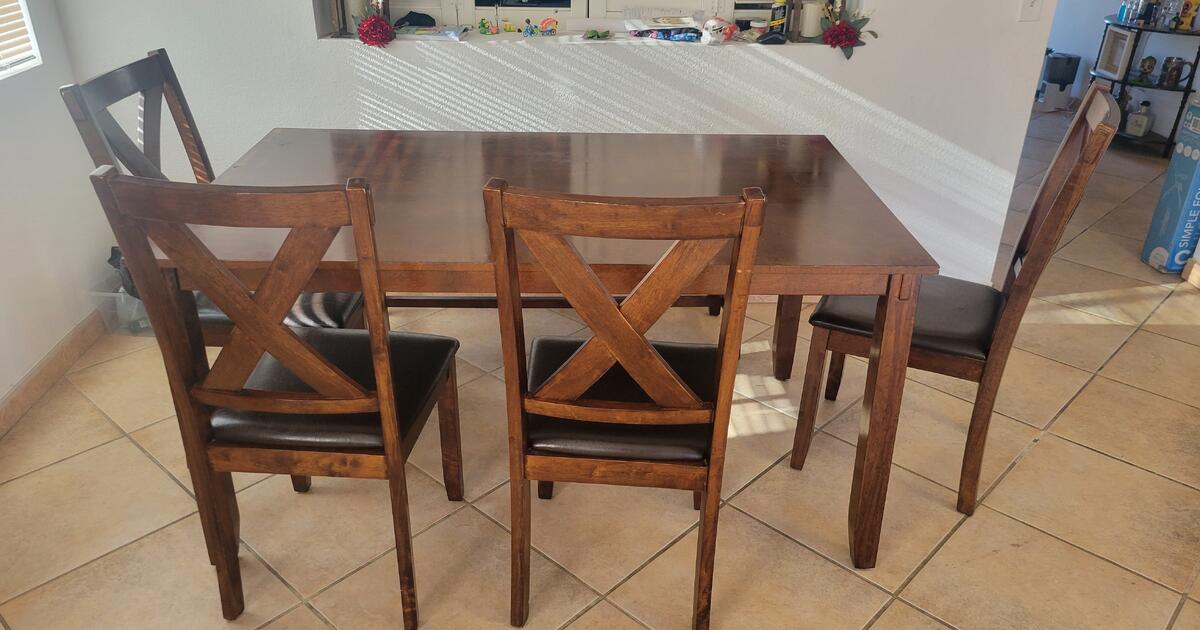 6 person wood dining table set with 4 chairs and a bench for 180 in San Bernardino, CA Finds