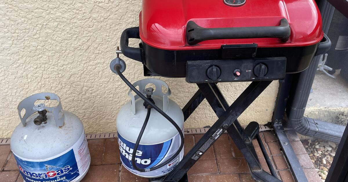 Coleman Roadtrip Portable Grill, Cover, & 2 Full Size Propane Tanks for