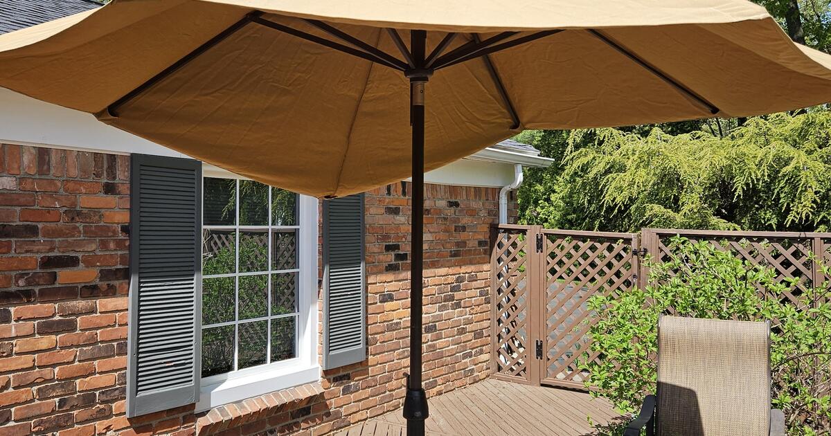 Costco Agio tan patio umbrella Sunbrella fabric for 20 in Bloomfield