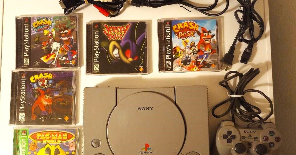 PlayStation with wires, controller, 2 memory cards and 5 games for 80