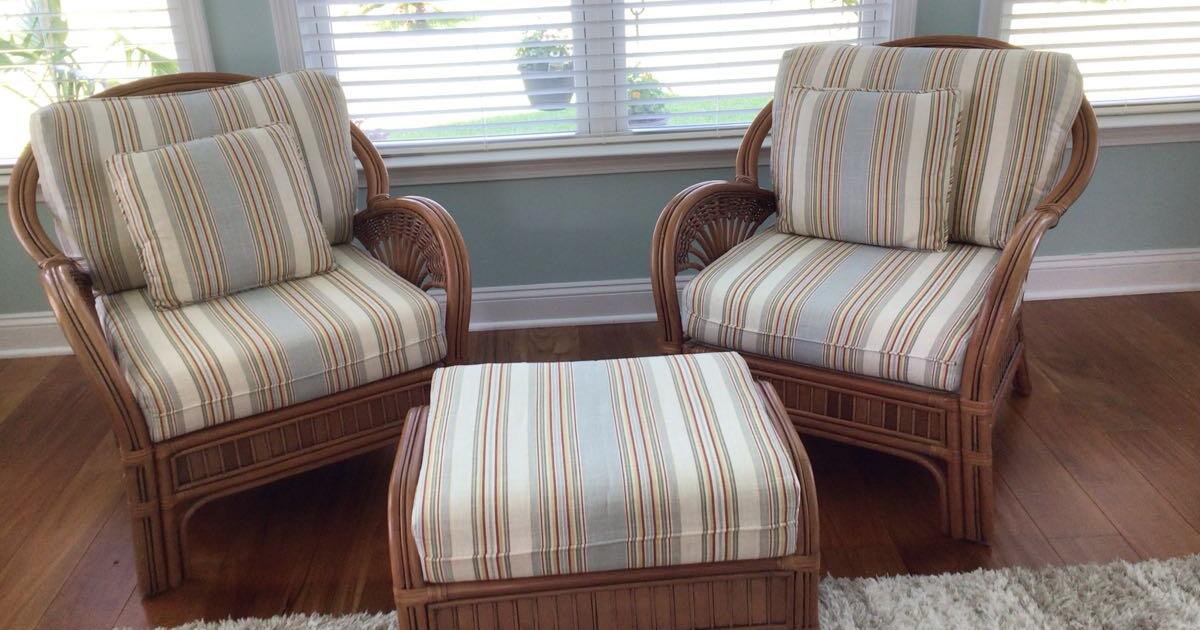 2 Rattan chairs with one matching ottoman and pillows. for 275 in