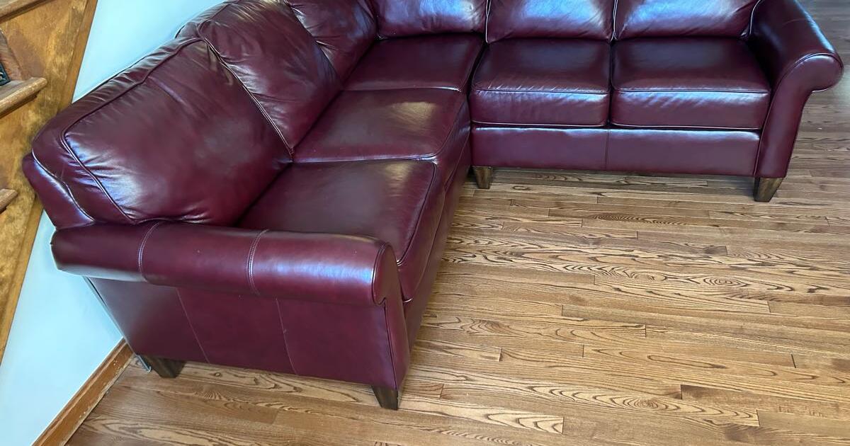 Burgundy Leather sectional with matching electric recliner for 5000 in