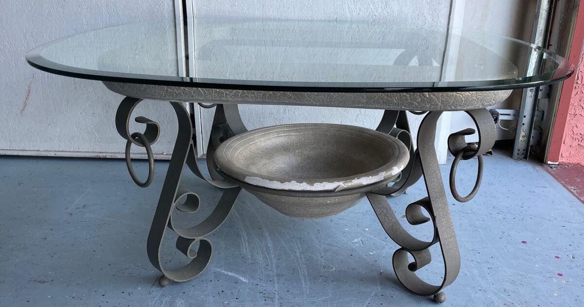 Glass top large coffee table with metal legs and ceramic accent for 20