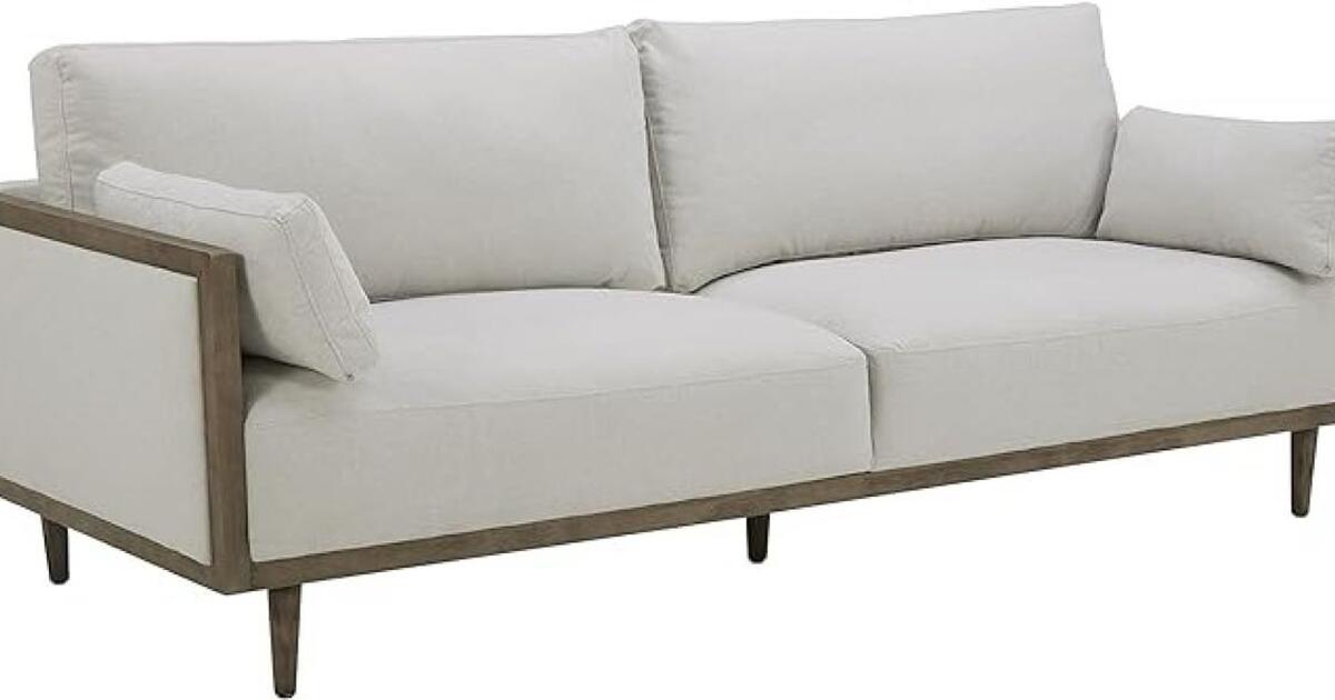 Cozy modern sofa available! Delivery possible nearby, offers welcome