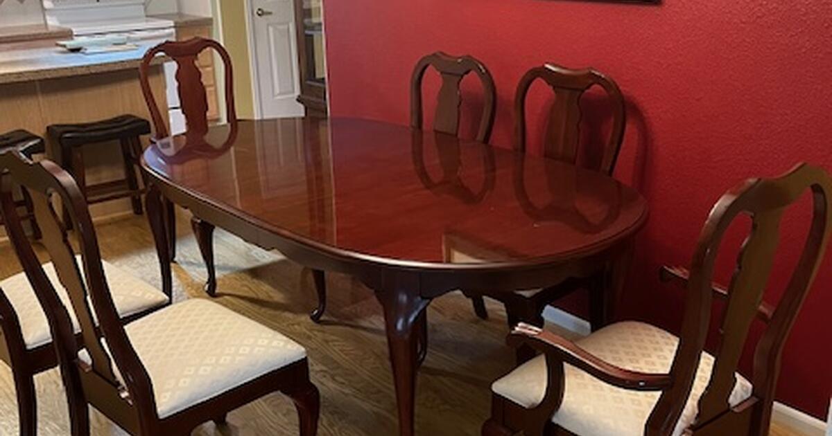 Cherry wood table with extra leaf and 6 matching chairs. for Free in