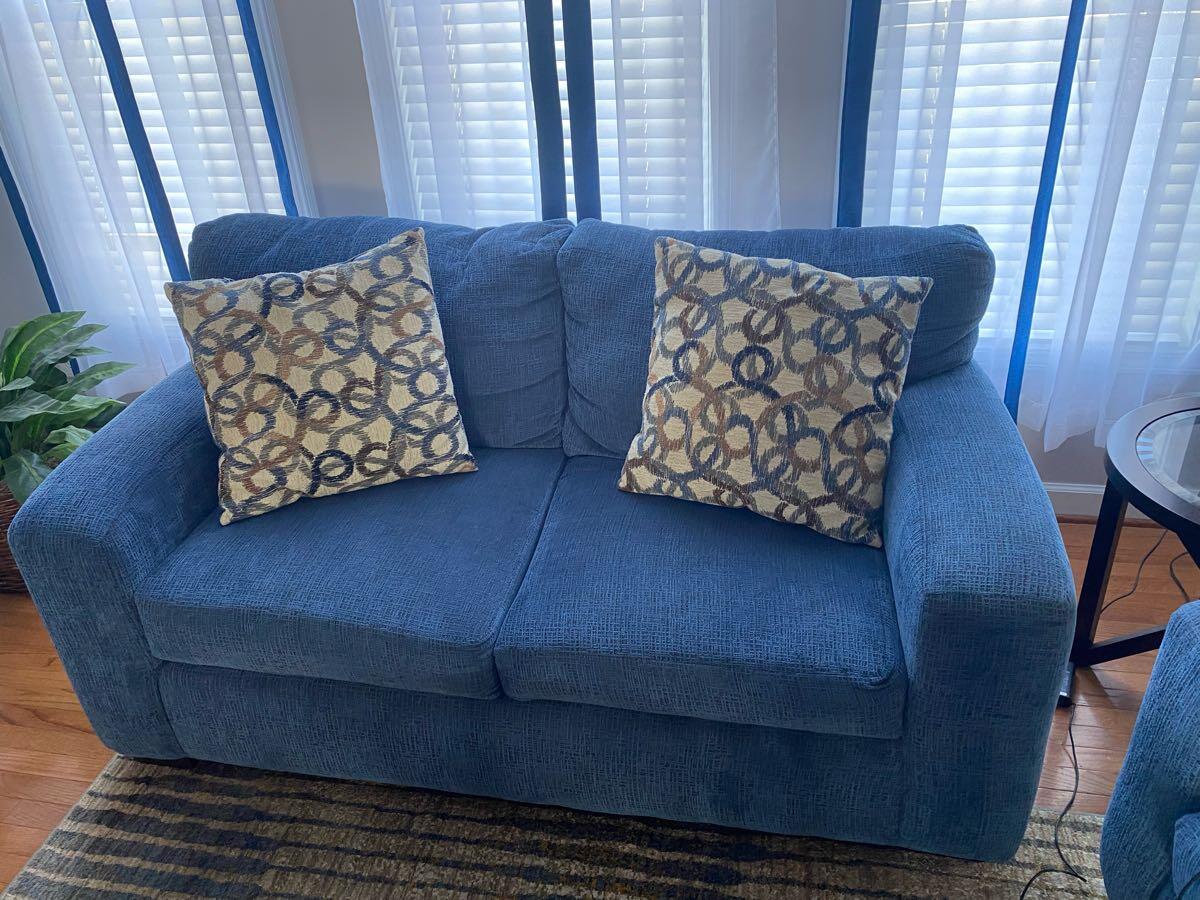 Blue Sofa with Patterned Cushions