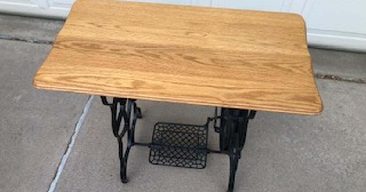 A Special piece, oak top and vintage sewing machine bottom. for 70 in
