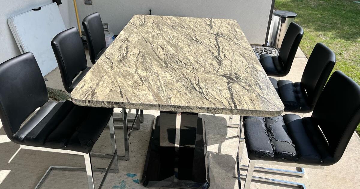 Breakfast dining table with 6 chairs. Table is in good condition