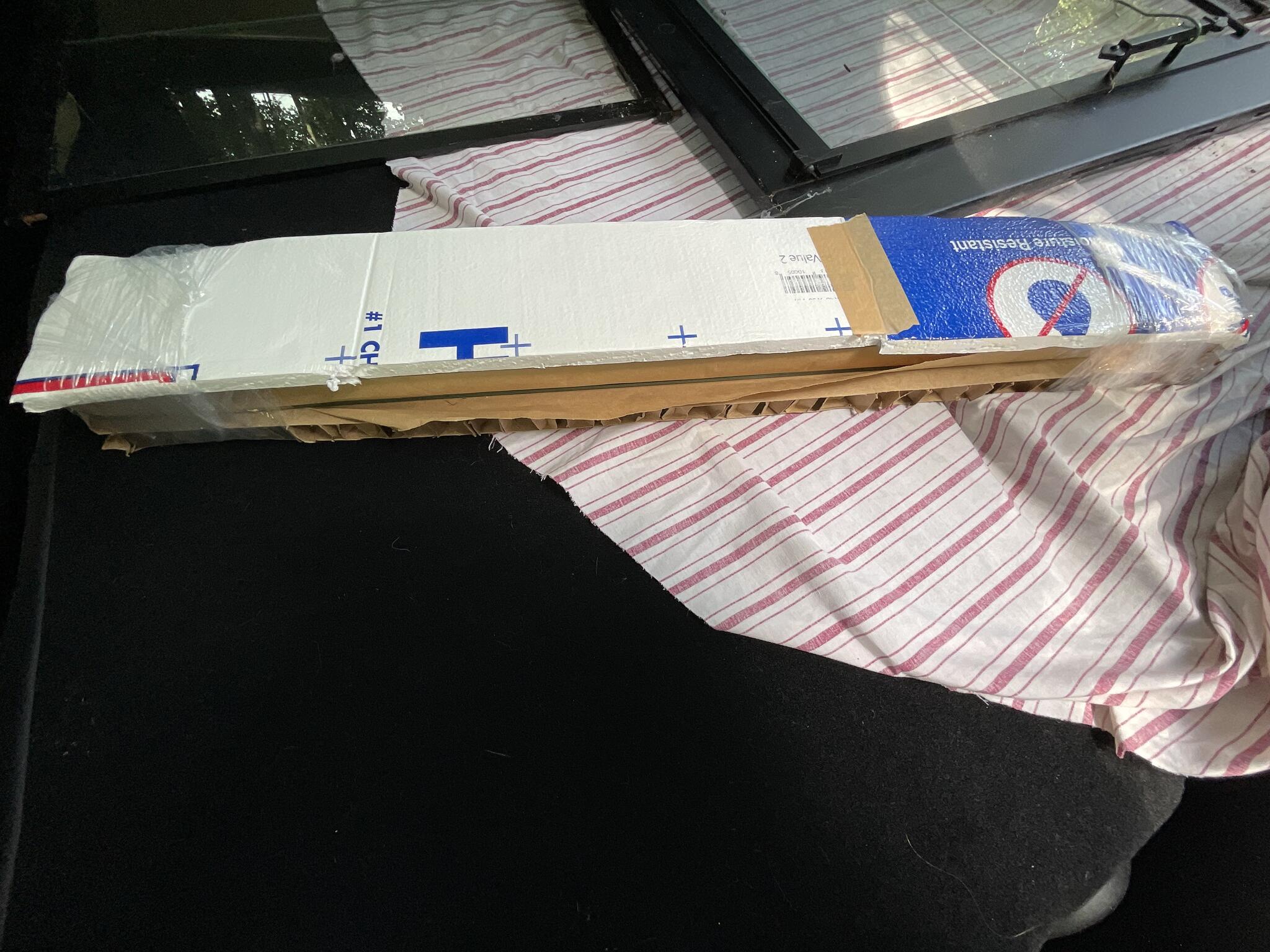 Glass for shelving still in packaging.