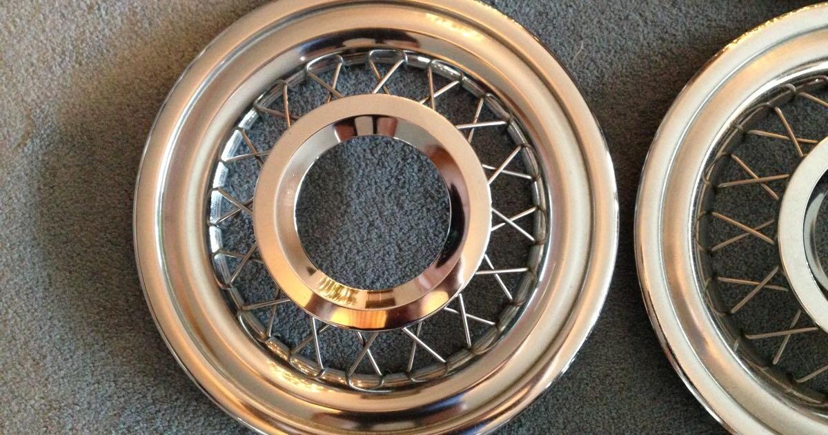 1955/56 Ford wire wheel covers with clips. Set of four. Original