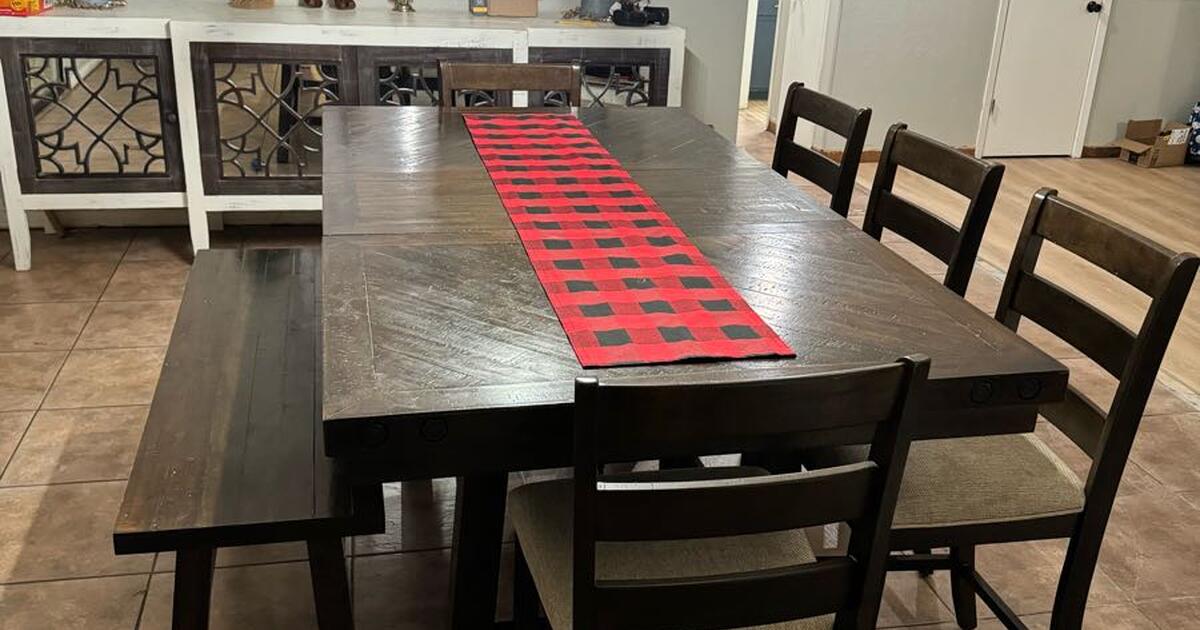 Basically new dining room table, 5 chairs, and a bench for 700 in