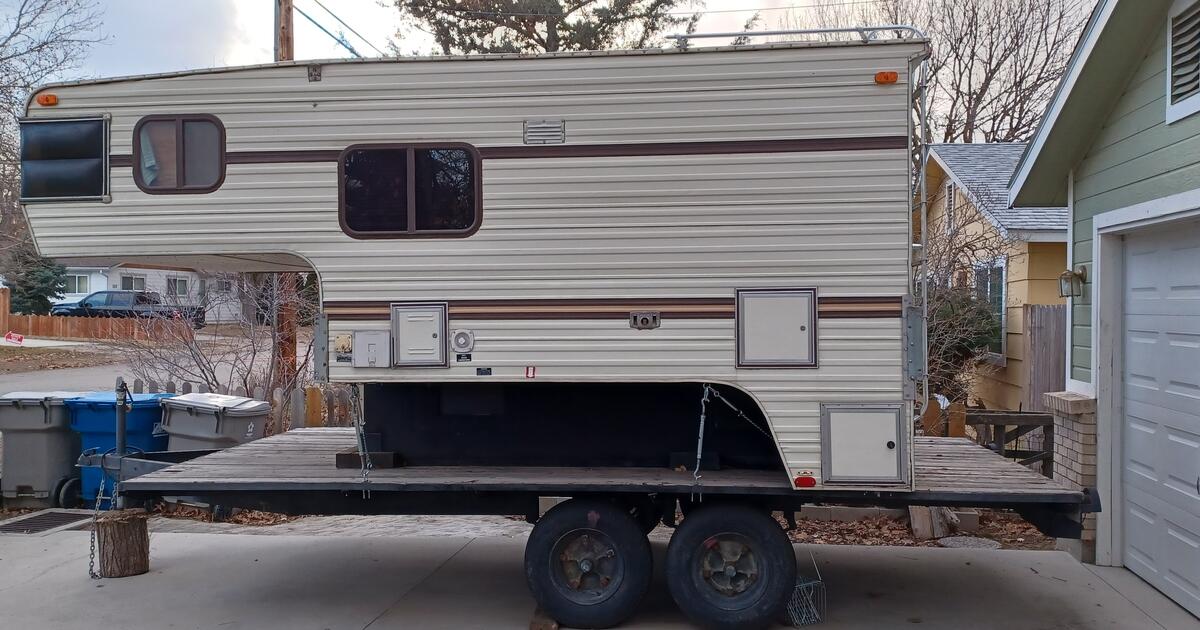 1989 S&S fully self contained truck camper mounted on a trailer