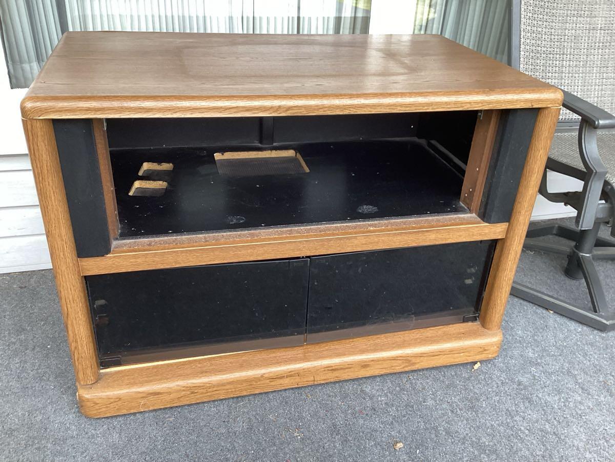 Free large, solid, heavy tv stand. Pick up on porch for Free in State