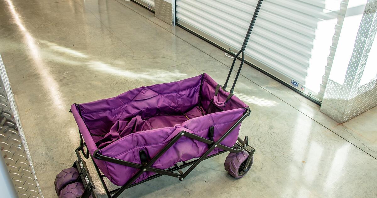 Folding canvas and metal tote cart with wide adjustable tires for 25