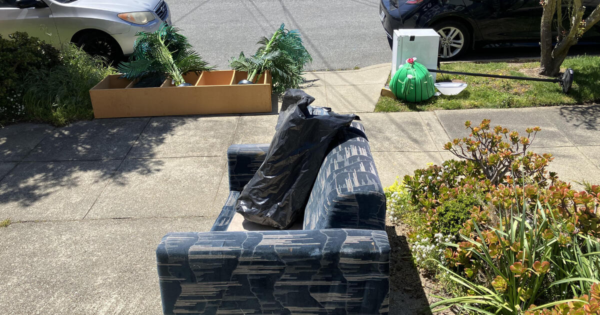 Mini fridge, couch, bookcase, desk and other miscellaneous items for