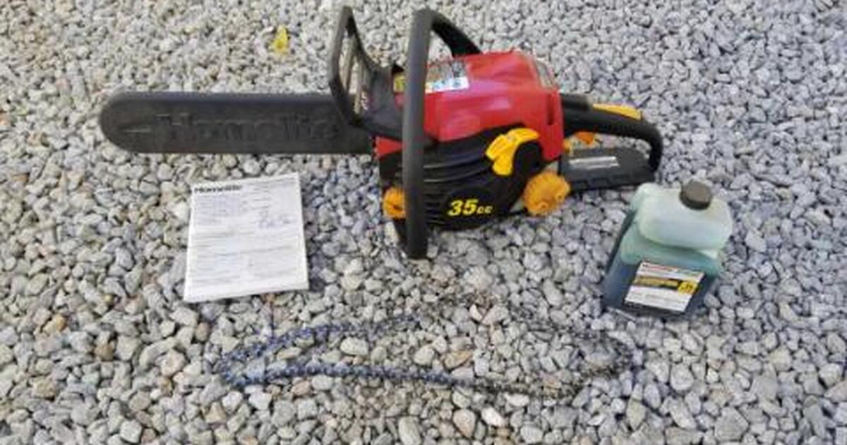 Homelite brand 35cc gas powered chain saw (with extra chain and gas mix