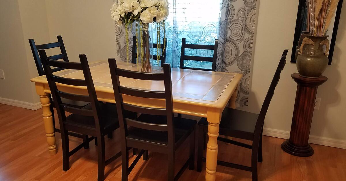 strong wood dinning table and six chairs for 100 in Kissimmee